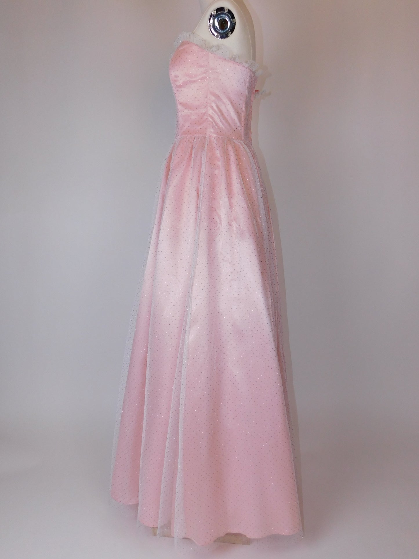 Side view of 1980s Gunne Sax Jessica McClintock pink satin lace strapless gown showing romantic A-line silhouette