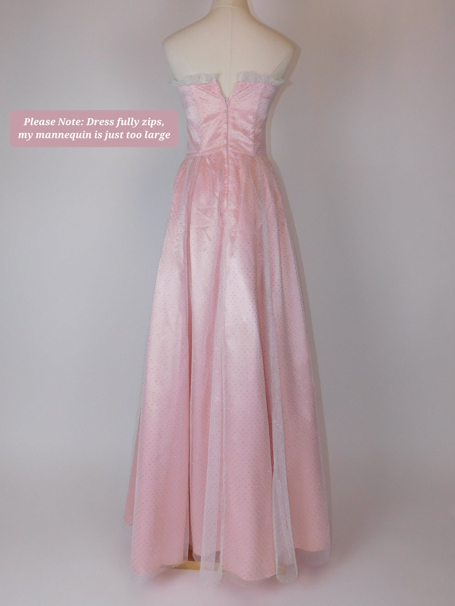Back view of 1980s Jessica McClintock Gunne Sax pink satin strapless gown with lace trim and full sweeping skirt