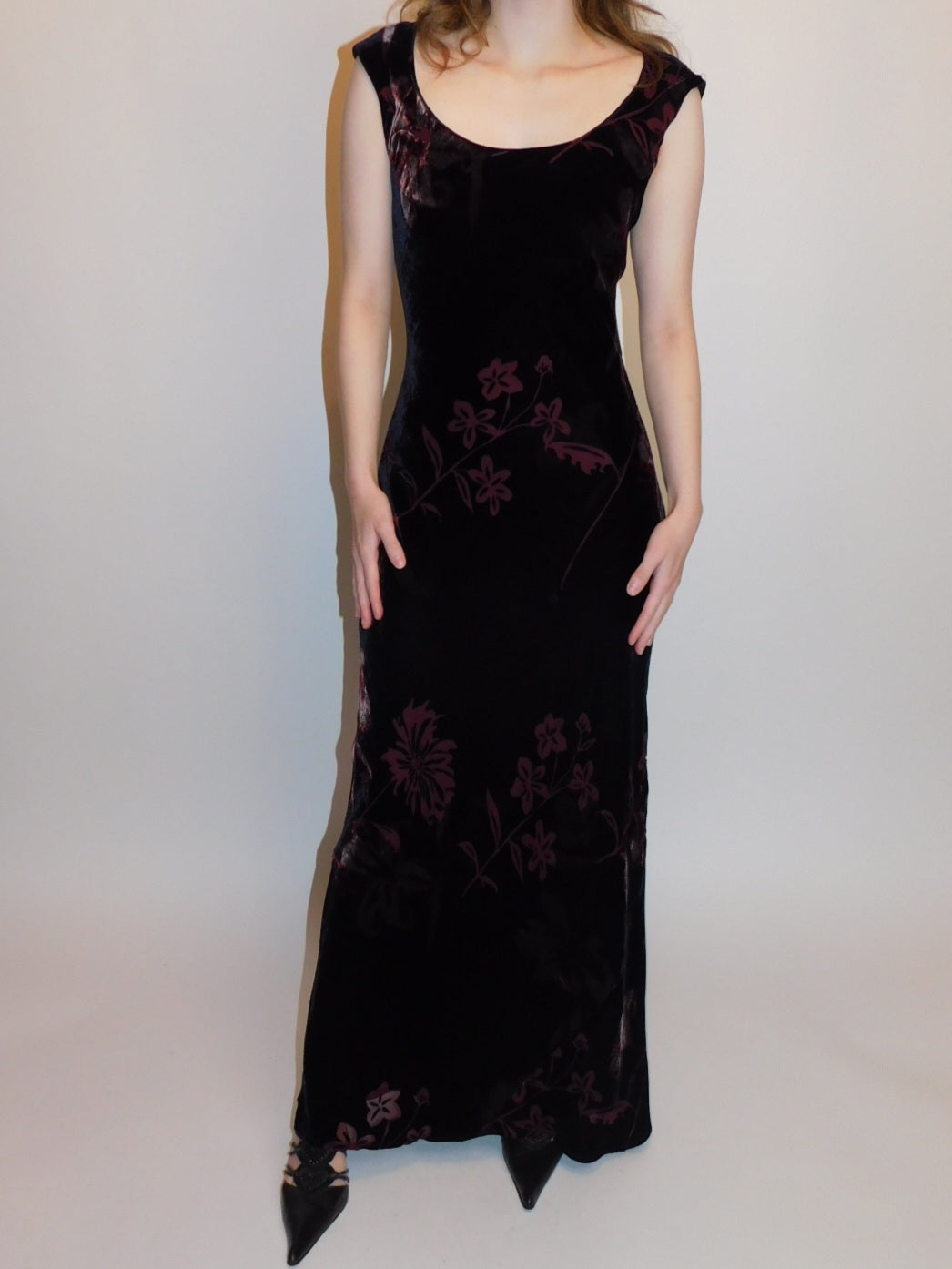 Full-length shot of black silk velvet devoré gown with merlot floral motif, fitted silhouette, cap sleeves