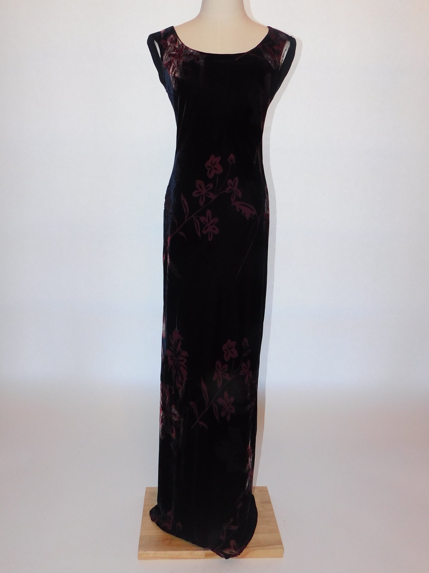 Full-length shot of black silk velvet devoré gown with merlot floral motif, fitted silhouette, cap sleeves