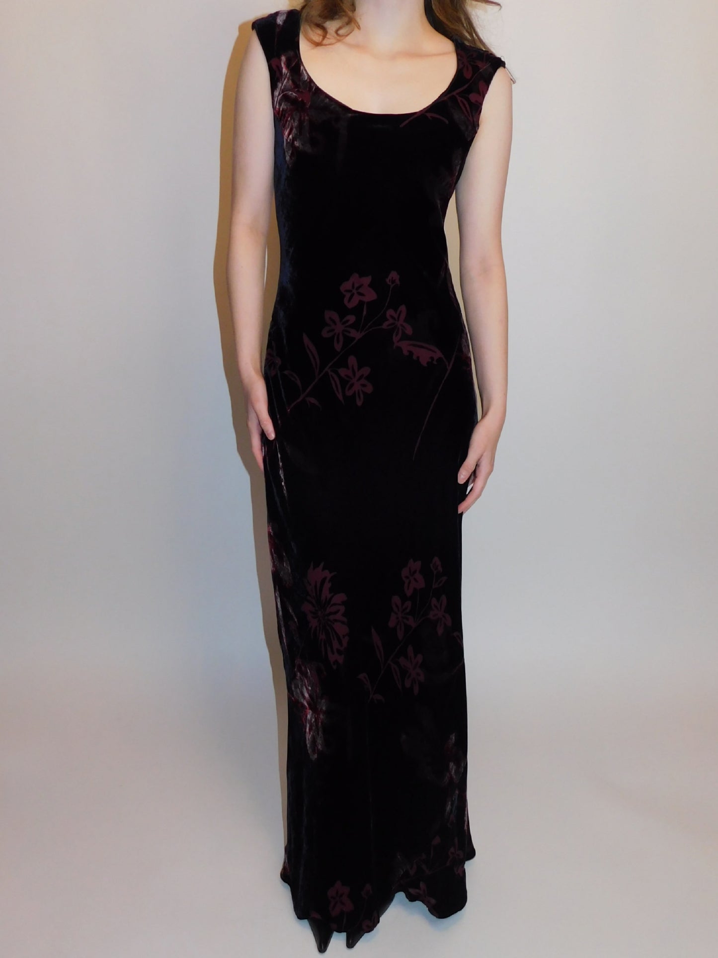 Front view of 90s silk burnout velvet gown with scoop neckline, deep burgundy floral pattern, modeled against white backdrop