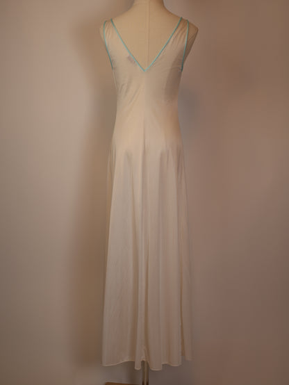 Back view of 1970s white satin maxi slip dress with mint lace trim and V-cut back, romantic vintage lingerie style
