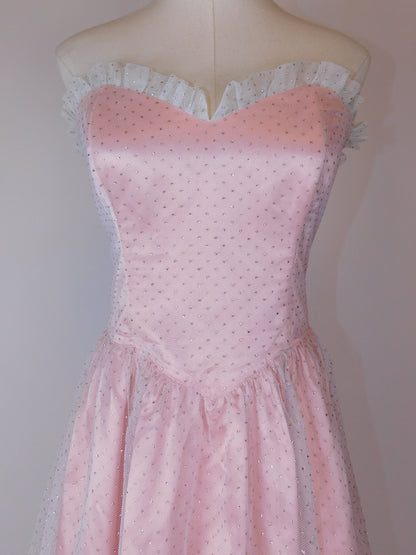 Detailed close-up of bodice on 1980s Jessica McClintock Gunne Sax pink satin strapless gown with lace neckline