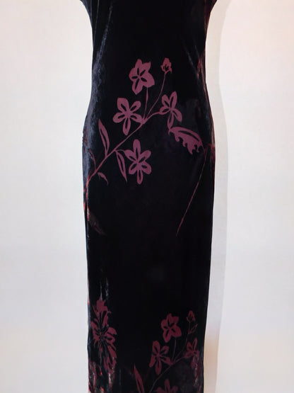 Detail of lower half of 90s velvet gown showing burgundy floral burnout design on black silk base